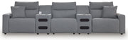 Signature Design by Ashley Modmax II reclining sectional in salt and pepper fabric, showing plush cushions and reclining features.