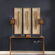 Set of three Uttermost Palma leaf shadow box wall decor in gold, featuring intricate leaf designs for stylish home decoration.