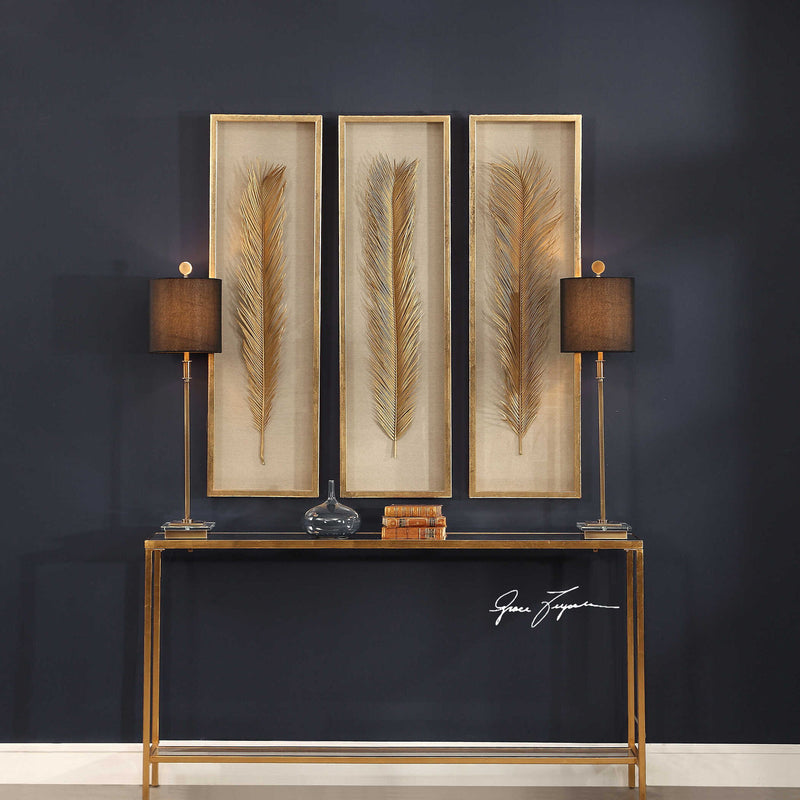 Set of three Uttermost Palma leaf shadow box wall decor in gold, featuring intricate leaf designs for stylish home decoration.