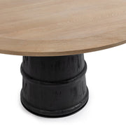Lunen 55-inch round dining table by Classic Home with soft reef noir finish, showcasing a modern design and smooth surface.