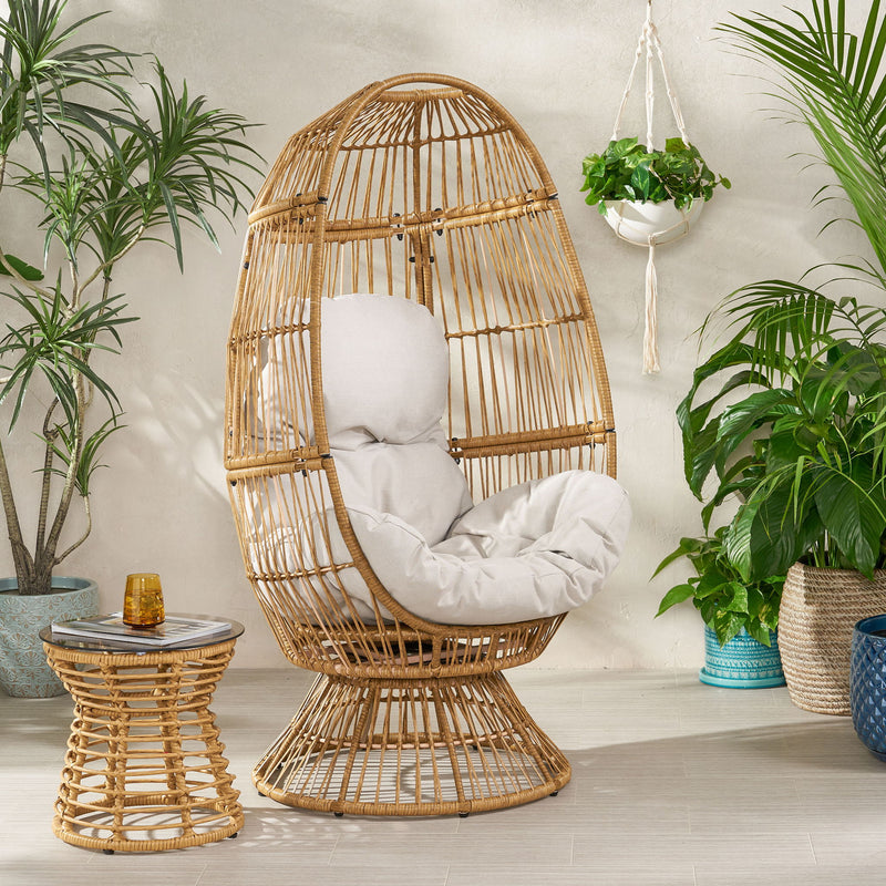 Noble House patio swivel basket egg chair with cushion, outdoor accent chair featuring woven design and plush seating.