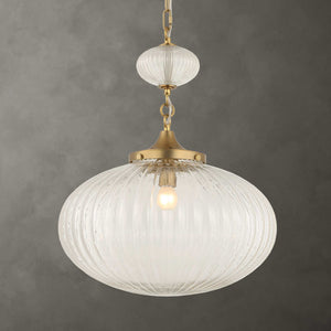 Uttermost Bellaire 1-light pendant with gold finish and glass shade, hanging from a ceiling fixture in modern pendant lighting style.