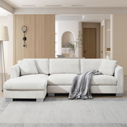 Luxe & Co. modern cloud L-shaped sectional sofa with oversized chaise, two throw pillows, and plush seating for four.