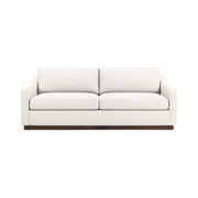 Classic Home Aspen stationary sofa with plush upholstery and modern design, shown in a cozy living room setting.