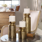 Set of 3 Amina candleholders in antique brass with sculptural, artistic design from Uttermost, perfect for decorative display.