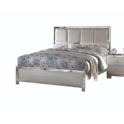 Upholstered Voeville II bed by ACME with padded headboard, featuring soft fabric upholstery and a modern design.