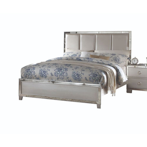 Upholstered Voeville II bed by ACME with padded headboard, featuring soft fabric upholstery and a modern design.