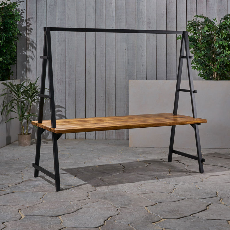 Noble House Huckleberry outdoor dining table with acacia wood surface and built-in plant hanger, teak finish, modern design.