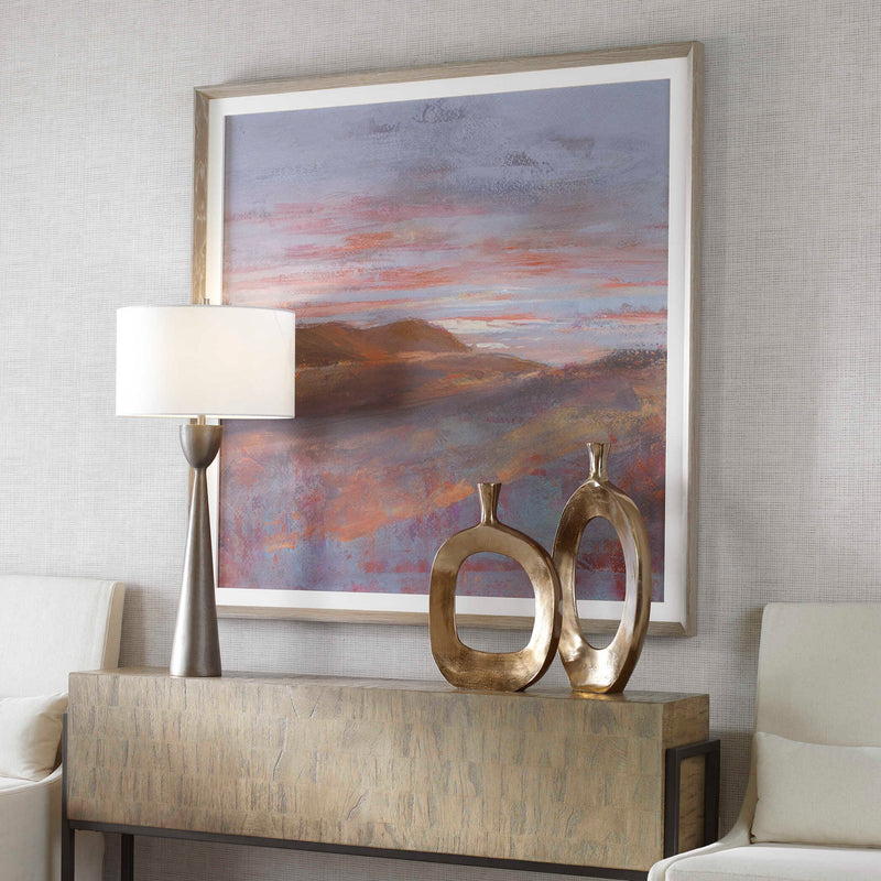 Framed print titled Dawn On The Hills by Uttermost, featuring a purple landscape scene in a stylish frame.