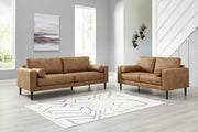 Stationary living room chair with matching ottoman from Signature Design by Ashley, featuring plush upholstery and modern design.