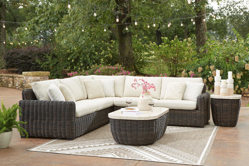 Kimora outdoor sectional by Signature Design Ashley, featuring cushioned stationary sectional with weather-resistant wicker frame.