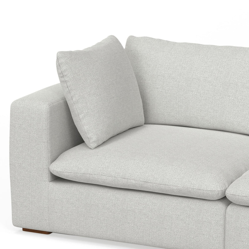 Jasmine handcrafted sofa and ottoman set in a modern living room by Simpli-Home, featuring plush cushions and neutral upholstery.