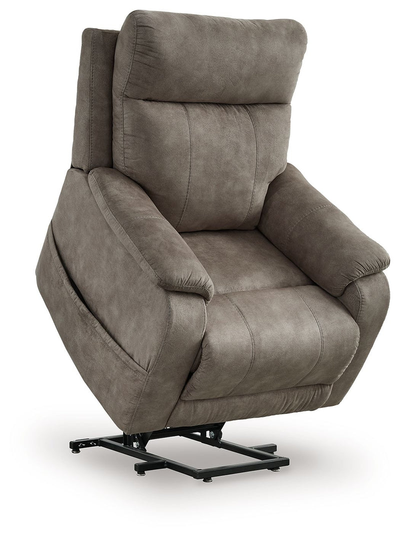 Signature Design by Ashley Crestmeade Power Lift Recliner with plush upholstery and padded armrests, showcasing its comfortable, adjustable design.