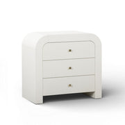 TOV Furniture Hump bedside chest with wooden finish and metal handle, featuring drawers for bedroom storage.