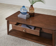 Rectangular medium brown cocktail table from Signature Design by Ashley, featuring a sleek wooden surface and modern design.