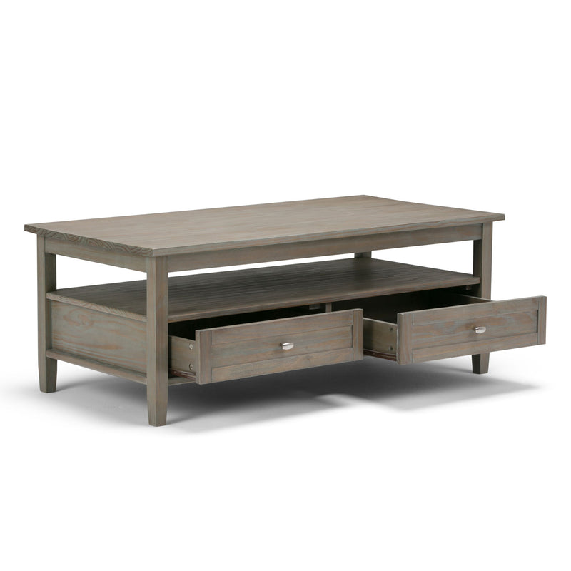 Handcrafted Warm Shaker coffee table by Simpli-Home featuring a wooden surface and sturdy legs in a warm finish.