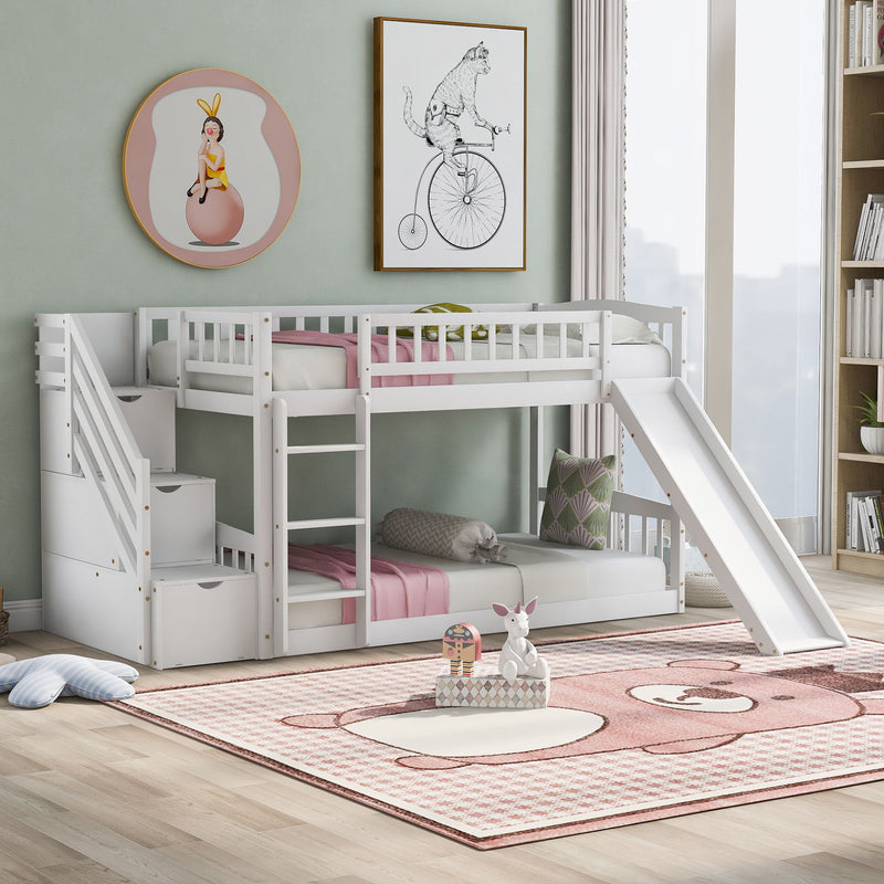 DreamHaus twin over twin stairway bunk bed with two drawers and slide, featuring sturdy wood construction and safety railings.