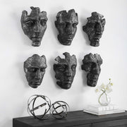 Set of six Uttermost Self-Portrait Mask wall decor pieces featuring artistic, carved designs in neutral tones for modern interior decor.