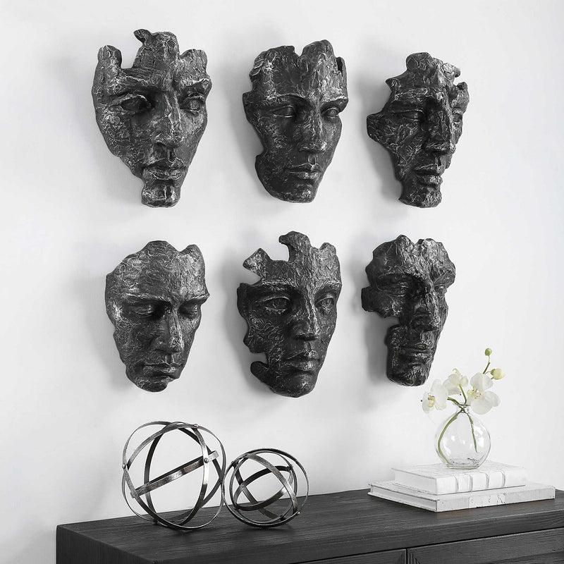 Set of six Uttermost Self-Portrait Mask wall decor pieces featuring artistic, carved designs in neutral tones for modern interior decor.