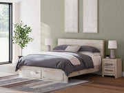 Signature Design by Ashley Lawroy panel bed with built-in storage drawers in a modern bedroom setting.