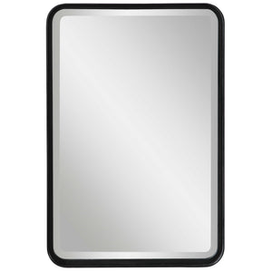 Black Croften vanity mirror by Uttermost featuring a sleek, modern design with a round reflective surface.
