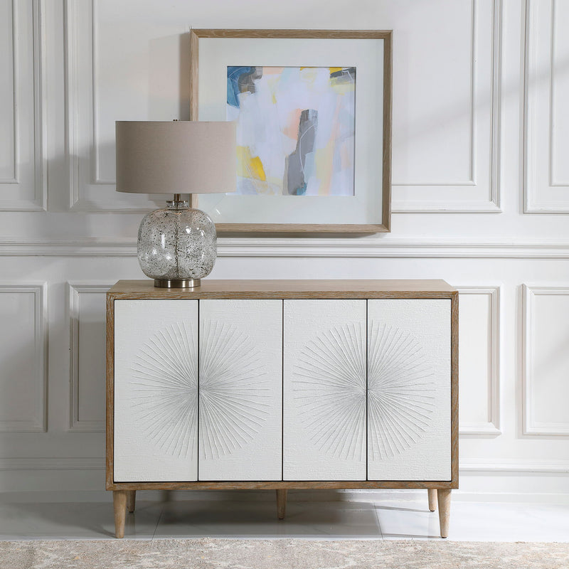 White Dani 4-door accent cabinet by Uttermost with sleek modern design and clean lines, shown with closed doors.