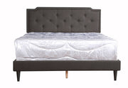 Upholstered button-tufted bed by Glory Furniture, cozy and stylish for comfortable bedroom spaces, featuring a plush fabric finish.