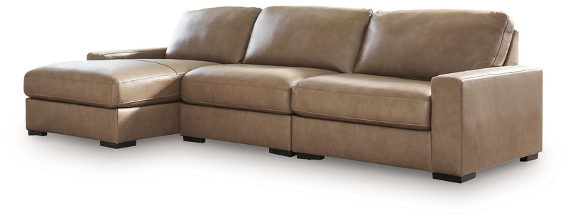 Benchcraft Veronella stationary sectional sofa with plush cushions and modern design, shown in a spacious living room setting.