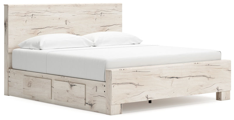 Signature Design by Ashley Lawroy panel storage bed with built-in drawers and a modern wood finish in a bedroom setting.