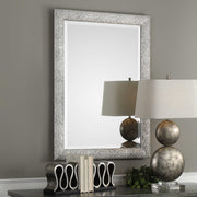 Uttermost Mossley metallic silver wall mirror with a round, textured frame perfect for modern home decor.