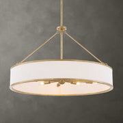 Uttermost Algiers 8-light gold and white drum pendant lighting fixture hanging from ceiling.