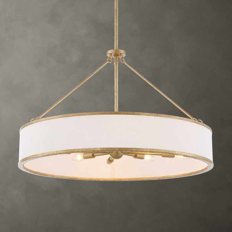 Uttermost Algiers 8-light gold and white drum pendant lighting fixture hanging from ceiling.