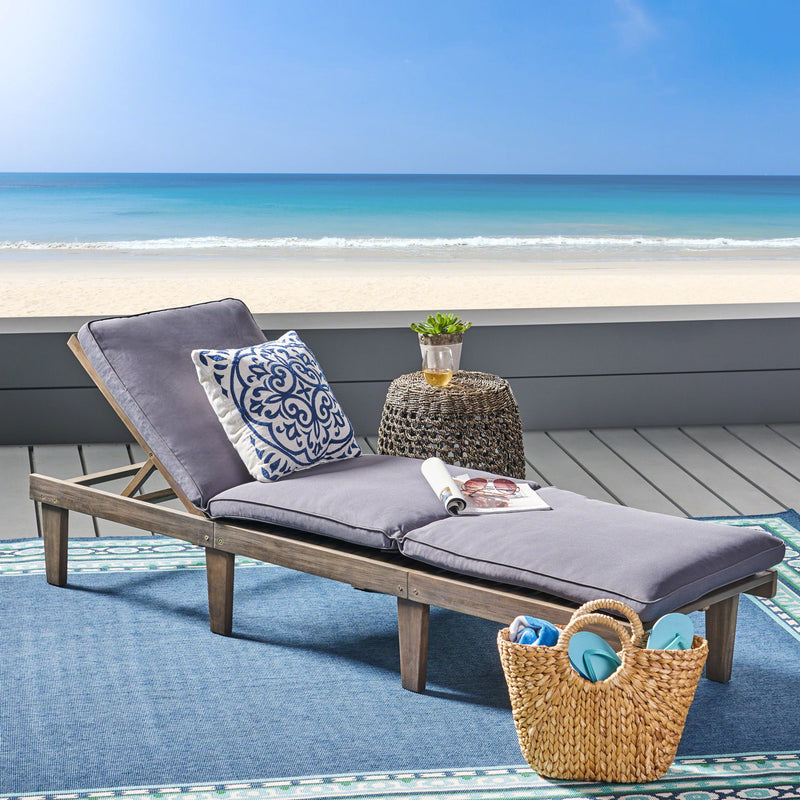 Noble House Ariana wood chaise lounge with a cushioned seat, featuring a sleek design and smooth finish.