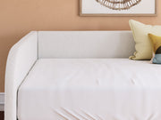 Signature Design by Ashley Arloster upholstered day bed with plush fabric and tufted backrest in a cozy, modern style.