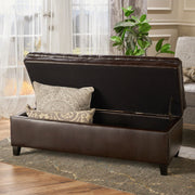 Noble House Juliana storage ottoman with birch wood legs, upholstered in soft fabric, serving as a stylish and functional storage piece.