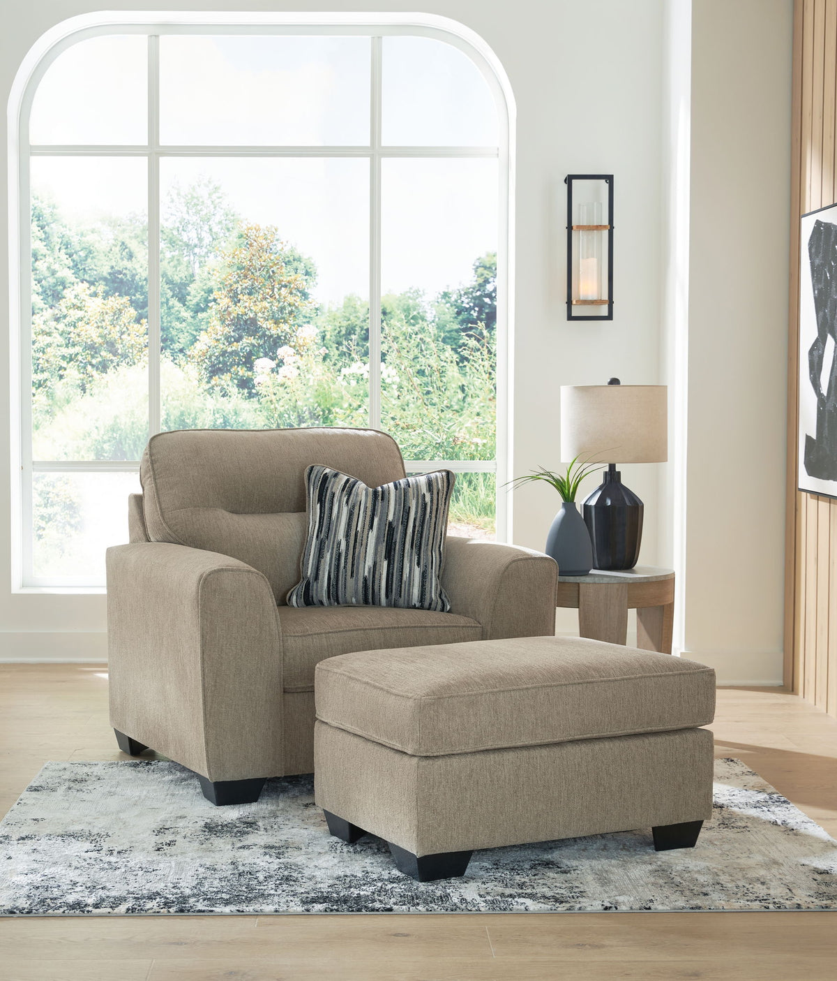 Benchcraft Olten stationary living room set with a comfortable chair and matching ottoman, featuring plush upholstery and modern design.