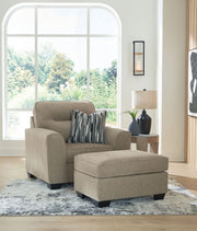 Benchcraft Olten stationary living room set with a comfortable chair and matching ottoman, featuring plush upholstery and modern design.