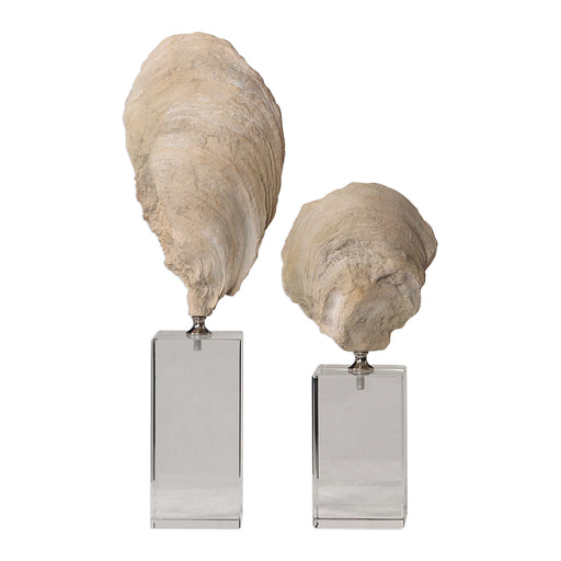 Set of two beige oyster shell sculptures by Uttermost, detailed textured figurines perfect for coastal home decor.