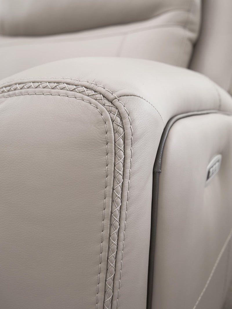 Benchcraft® Gravier reclining sectional sofa with plush cushions and reclining features, shown in a modern living room setting.