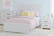 Signature Design by Ashley Cayboni panel bed with a sleek wooden frame and modern headboard design.