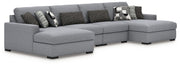 Benchcraft Bealton stationary sectional sofa with plush fabric, multiple seating sections, and modern design in a living room setting.