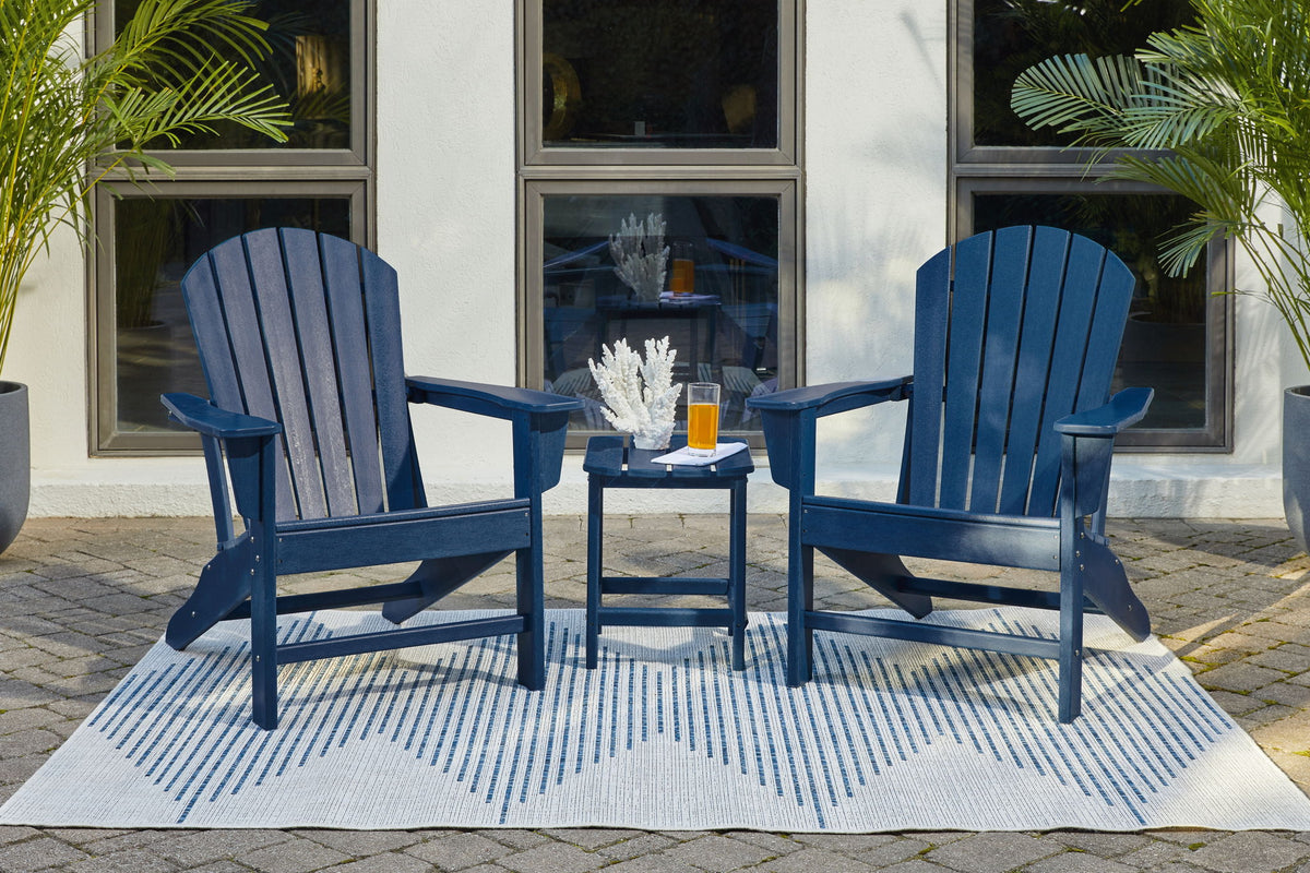 Signature Design by Ashley Sundown Treasure outdoor 3-piece conversation set with cushioned chairs and a central table in a backyard setting