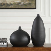 Set of two black Uttermost Bower vases with sleek, modern design, perfect for stylish home decor or floral arrangements.