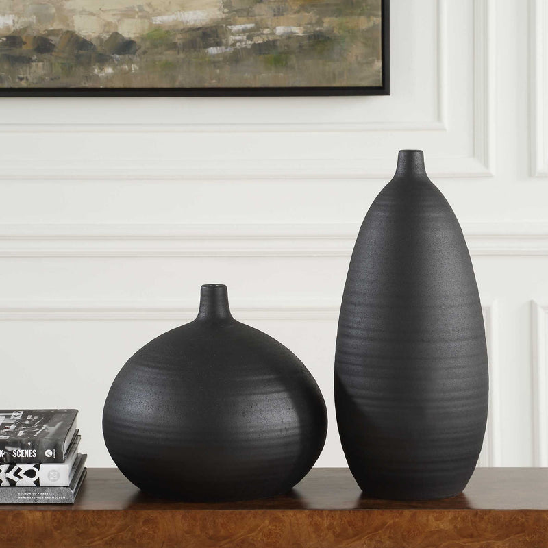 Set of two black Uttermost Bower vases with sleek, modern design, perfect for stylish home decor or floral arrangements.