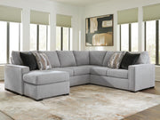 Benchcraft Lakepoint stationary sectional sofa with plush cushions and modern design, shown in a cozy living room setting.