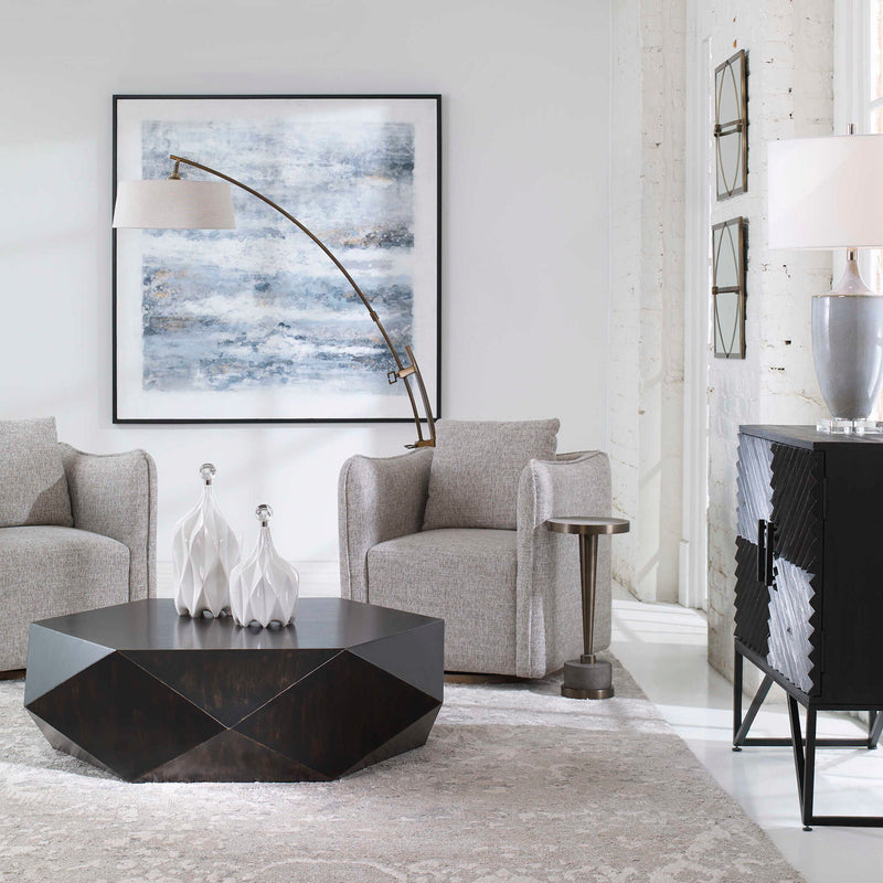 Uttermost Corben swivel chair featuring a plush upholstered seat, sleek metal base, and modern design for contemporary interiors.
