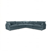 Classic Home Caplan modular sectional with plush fabric cushions and modern design, shown in a spacious living room setting.