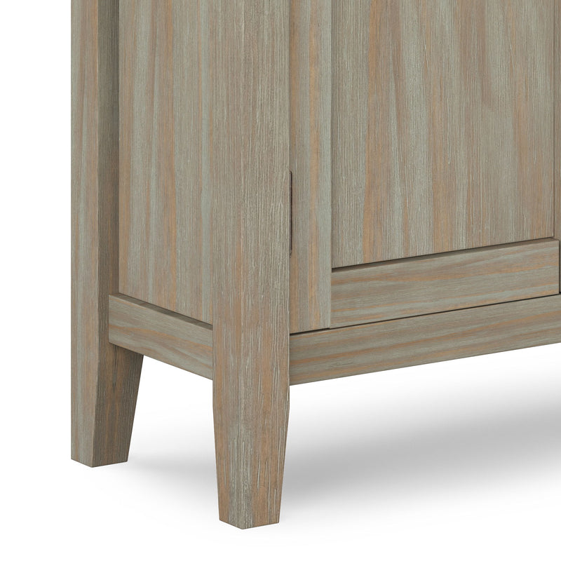 Redmond handcrafted low storage accent cabinet by Simpli-Home with a rich wood finish and sleek design.