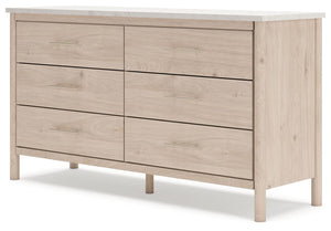 Signature Design by Ashley six-drawer dresser with sleek wood finish and modern hardware, offering ample storage space.