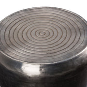 Antique silver metal accent table by Simpli-Home with a sleek round top and modern design, perfect for living room decor.